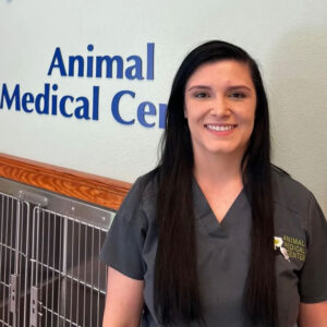 an Animal Medical Center team member outside the clinic's boarding facilities